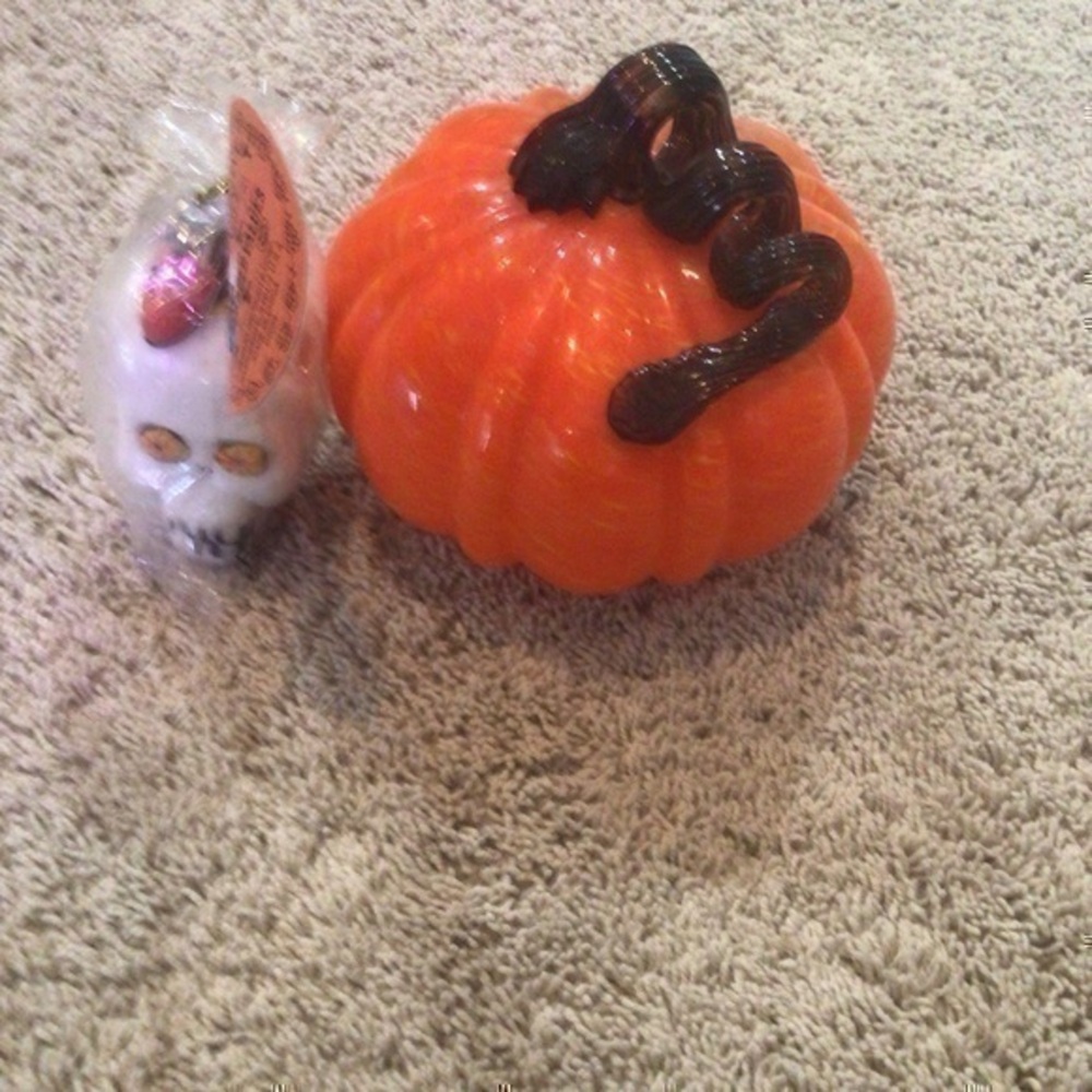 Halloween pumpkin decoration and skull candle